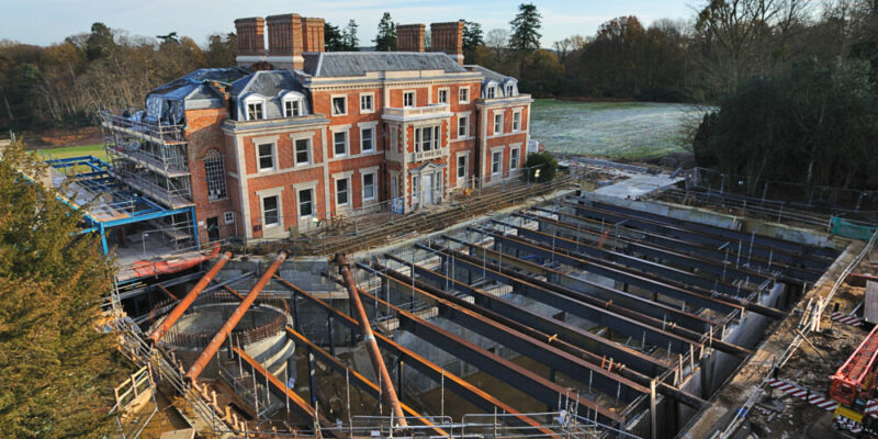 Drone shot of Heckfield Place having the foundation pipes laid.