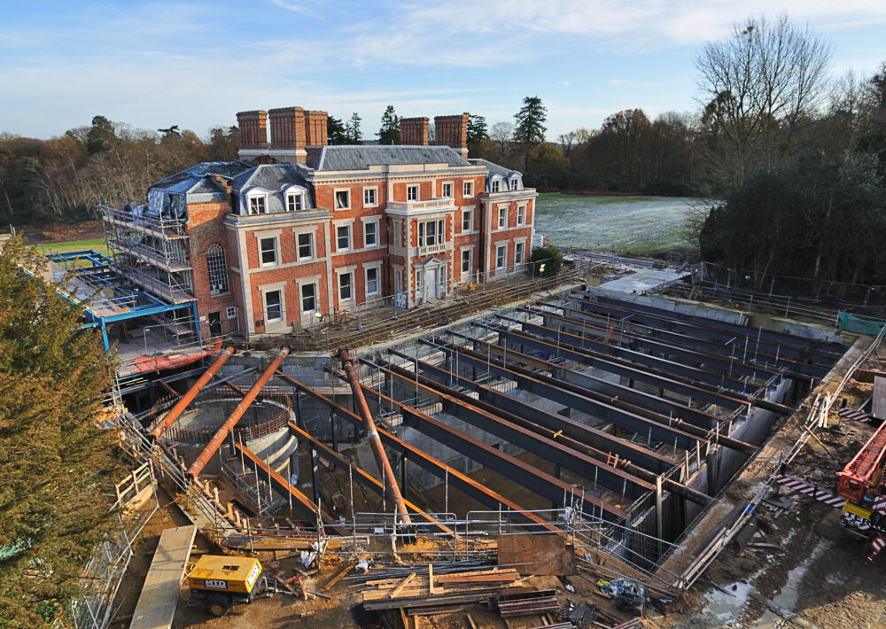 Drone shot of Heckfield Place having the foundation pipes laid.
