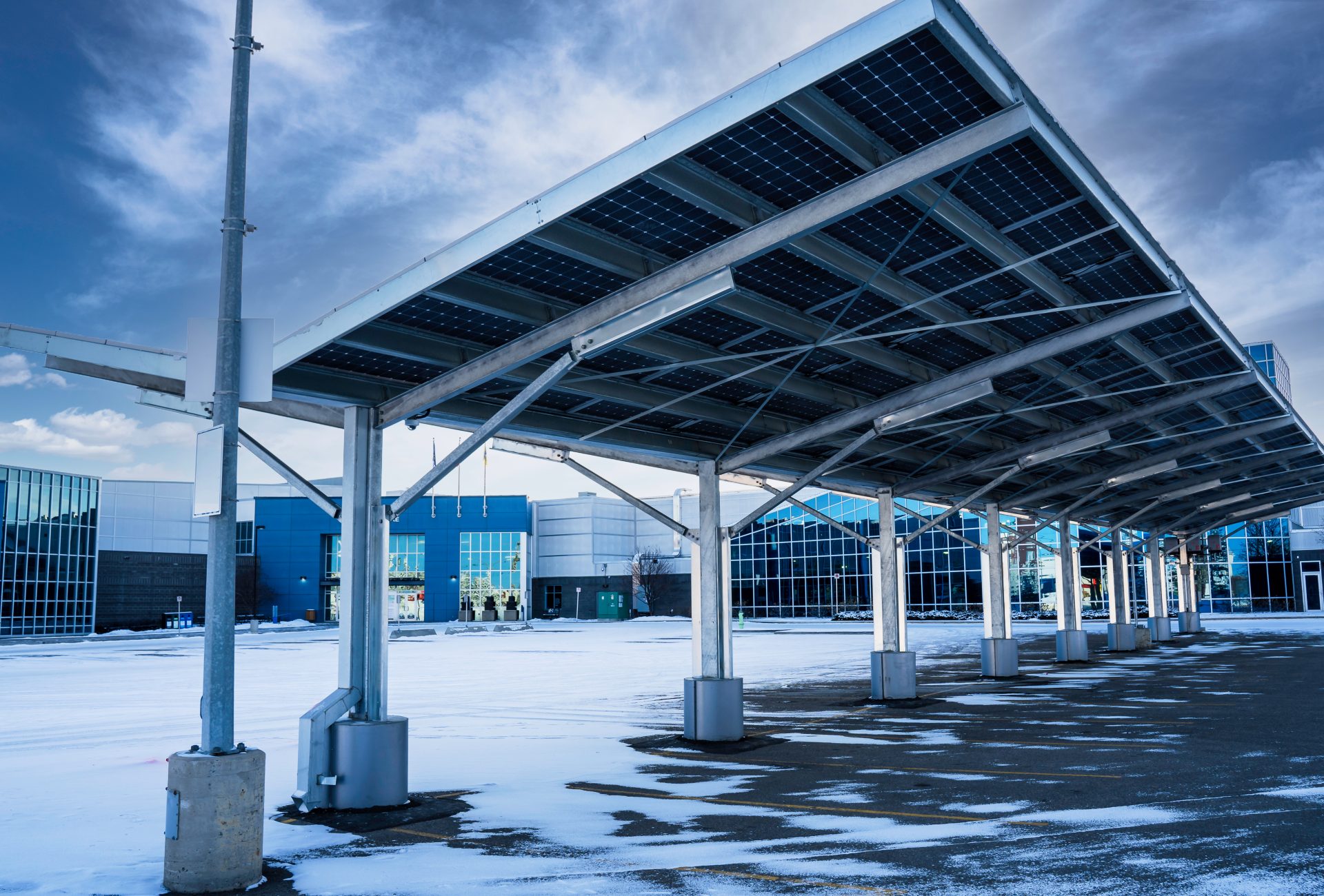 A solar carport for producing renewable energy and electric vehicles